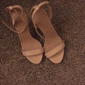 Nude colored strapped stiletto